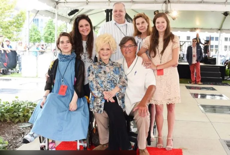 On August 21, 2018, Brenda Lee took a photo with her husband Ronnie Shacklett and family at the star ceremony of the Music City Walk of Fame Park in Nashville. According to the information, Jolie was also present at the time